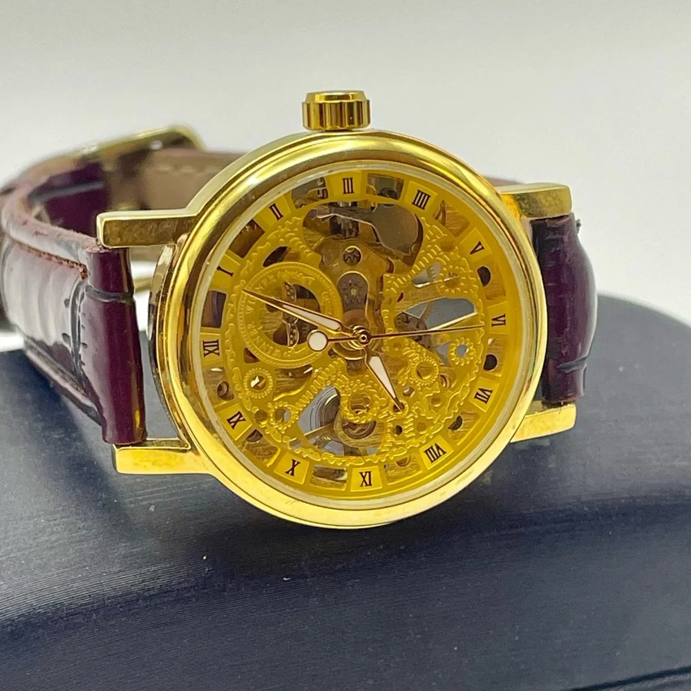 Gold Tone Skeleton Mechanical Watch with Burgundy Faux Textured Leather Strap